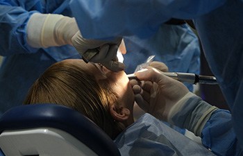 Woman getting oral surgery