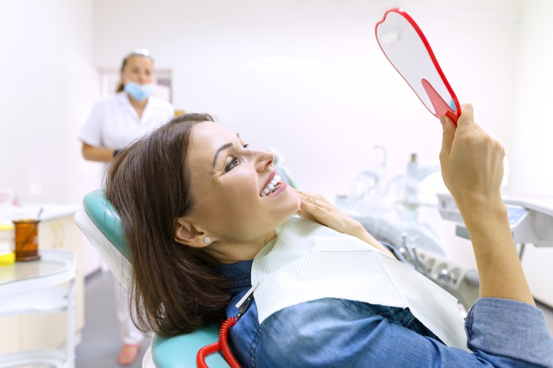 Patient smiling after cosmetic dentistry