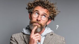 Man wearing curious, thoughtful expression 