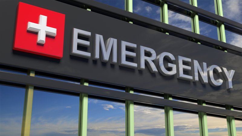 A closeup of a sign for an emergency room